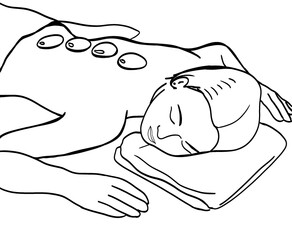 woman lying down receiving a hot stone massage session
