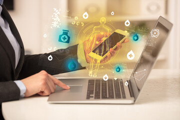 Doctor working on laptop with healthcare concept