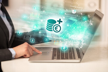 Young man watching stock market on laptop