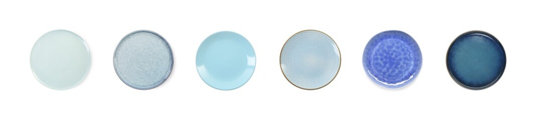 Clean ceramic plates isolated on white, top view