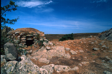 Remains of nuraghe or fortress from the bronze age at Archeological site of Tamuli, Sardinia island, Italy