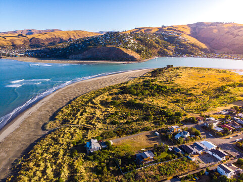 aerial panorama of christchurch city, new brighton beach, southshore and sumner beach at sunset;	