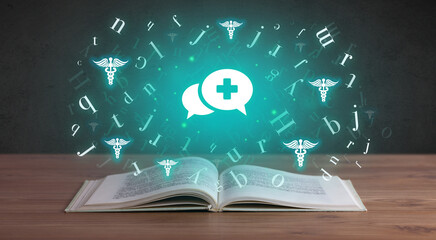 Open medical book with health icons above