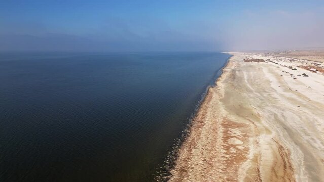 CALIFORNIA - 2.22.2024 - Excellent aerial footage moving over the shoreline of the Salton Sea off the coast of California.