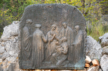 The Presentation of Jesus – Fourth Joyful Mystery of the Rosary. A relief sculpture on Mount Podbrdo (the Hill of Apparitions) in Medjugorje.