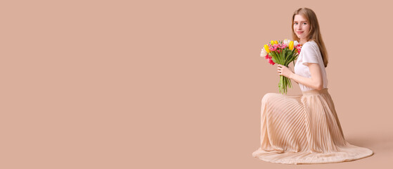 Beautiful young woman with bouquet of tulips on brown background