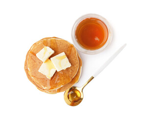 Tasty pancakes with butter and maple syrup on white background