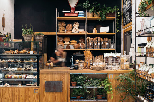 unrecognizable baker woman seller passing through artisanal bake