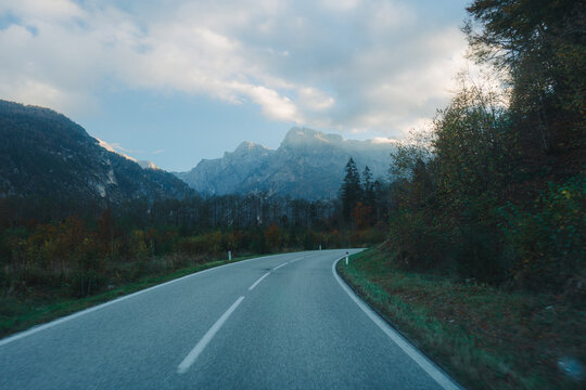 Scenic view road in the mountains covered in fog 