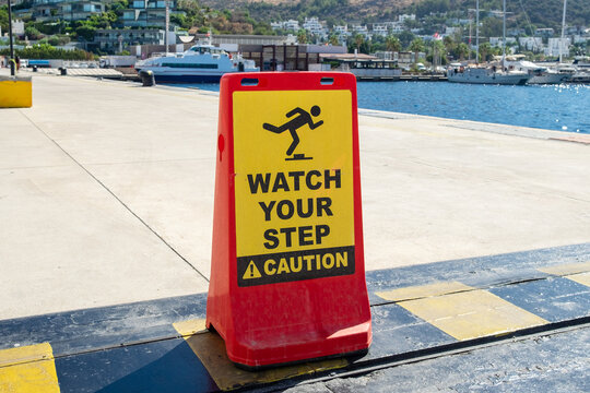 Safety sign next to cruise ship