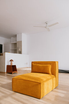 Modern couch in empty new apartment