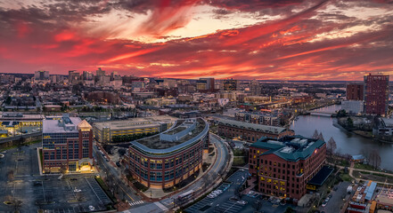 Aerial panorama view of downtown Wilmington Delaware headquarter of most US banks and companies with dramatic colorful cloudy sunset sky - obrazy, fototapety, plakaty