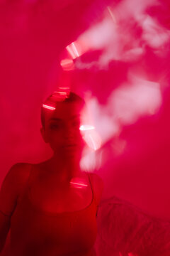 Surreal portrait of woman in red color