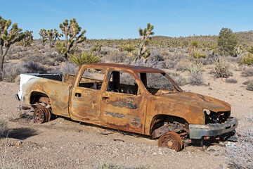 Burned Out And Rusted Pickup Truck In The Desert