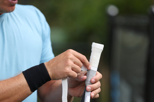 Re-gripping of pickleball paddle.