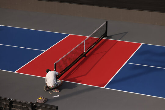 New pickleball court being prepared for a tournament