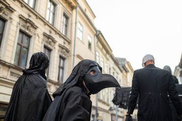 The person in the costume and mask of the plague doctor on Halloween