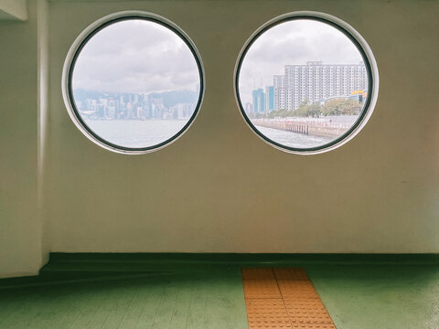 Urban View Through Ship Portholes