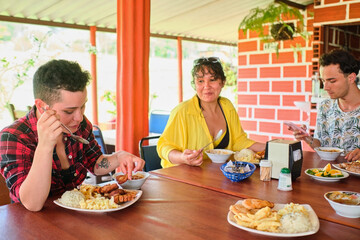 Diverse Friends Sharing A Meal In A Restaurant