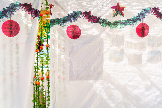 Sukkah Entrance Adorned with Apple Garland Decoration.