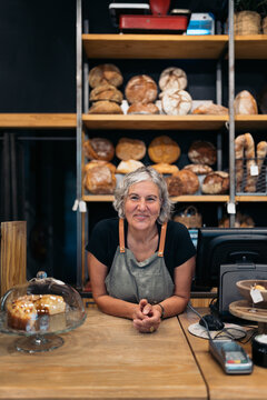 Cheerful female baker portrait