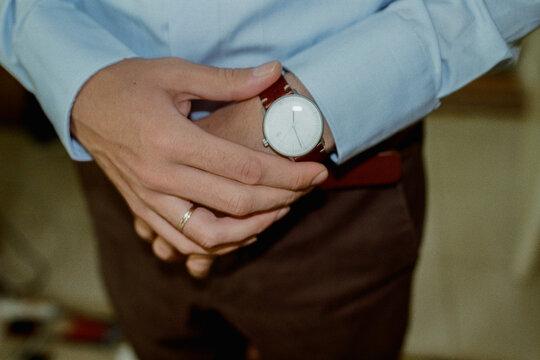 A man with a  wrist watch