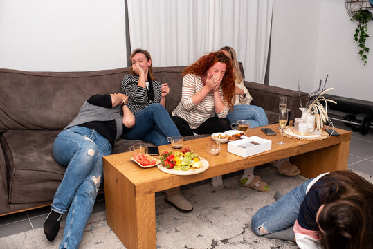 Friends Burst into Laughter at a Party.