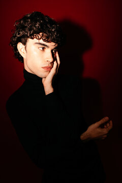 Male model touching face in studio
