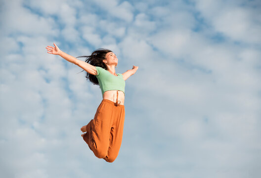 Confident woman doing jump of faith