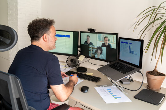 Man Attending Online Business Meeting At Home