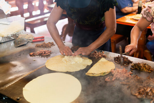Unrecognizable woman preparing traditional Mexican food.