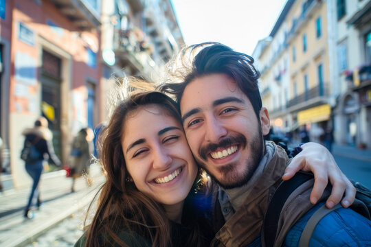 A man and a woman are posing for a picture and smiling
