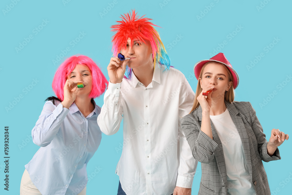 Poster Business people with party whistles on blue background. April Fools' Day celebration