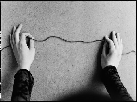 thread in the hands of a young woman, close-up