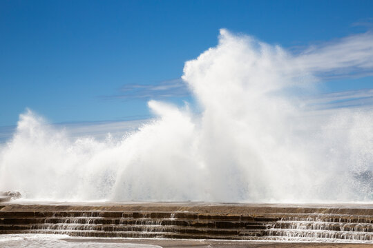 Sea Waves Crash Against A Seawall 