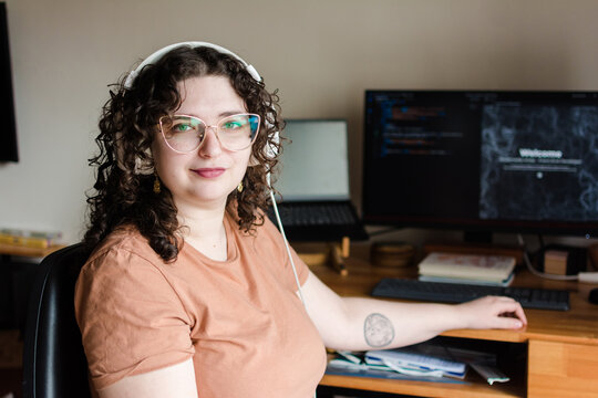 Proud woman working as a web coder
