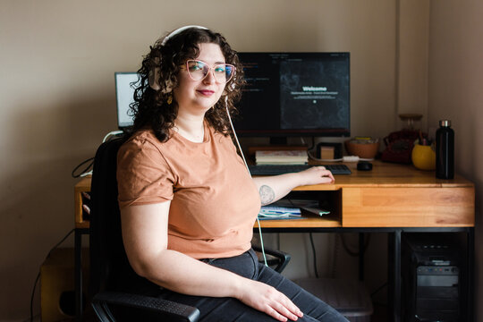 Proud, confident woman working in computer science portrait