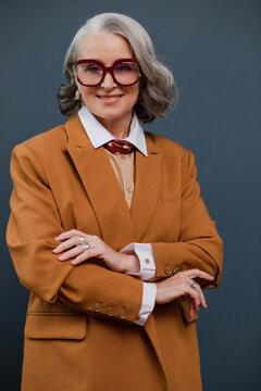Smiling woman in goggles on blue background 