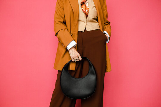 Stylish outfit of confident unrecognizable woman 