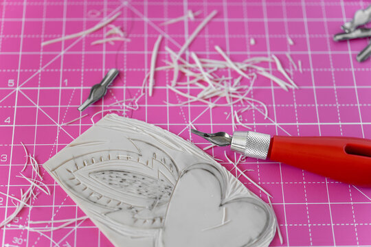 Linocut heart stamp print craft making. Love concept