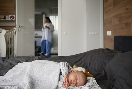 Adorable infant sleeping at home
