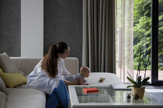 Woman with a baby at home