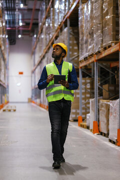Busy black logistics worker distribution center
