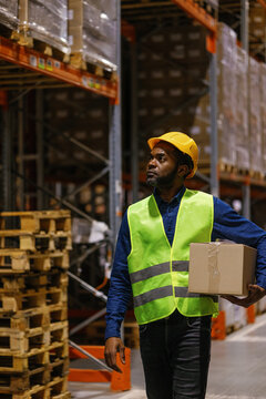 Warehouse company loader carrying box storage worker