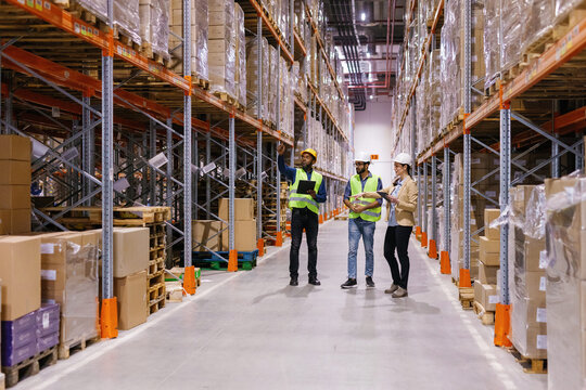 Warehouse workers standing distribution center