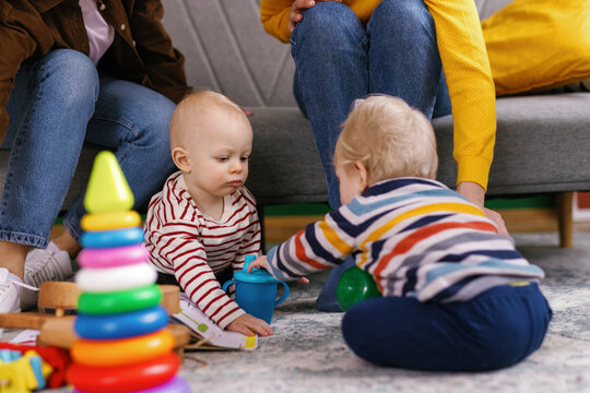 Playmate friend babyhood anonymous caregiver interaction playdate