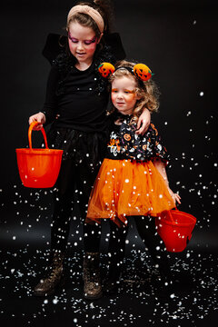 Two girls ready for trick or treating