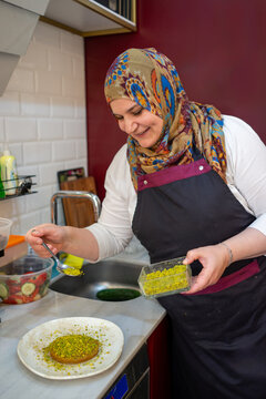 Muslim Cook Preparing Baklava for Serving