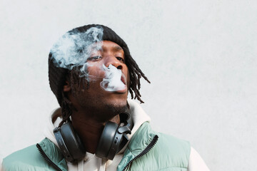 Black man smoking electronic cigarette