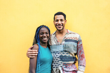Cheerful friends over yellow background